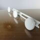 White lacquered metal wall coat rack with 3 hooks, 1970.