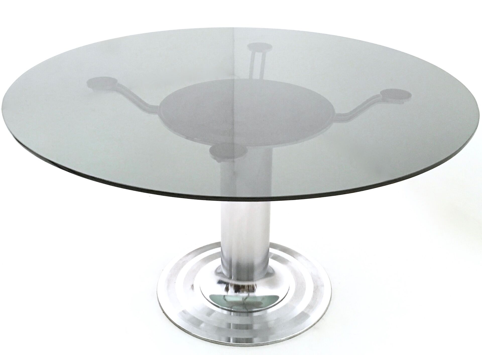 Postmodern chromed metal dining table with a round tempered glass top, italy
