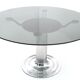 Postmodern chromed metal dining table with a round tempered glass top, italy