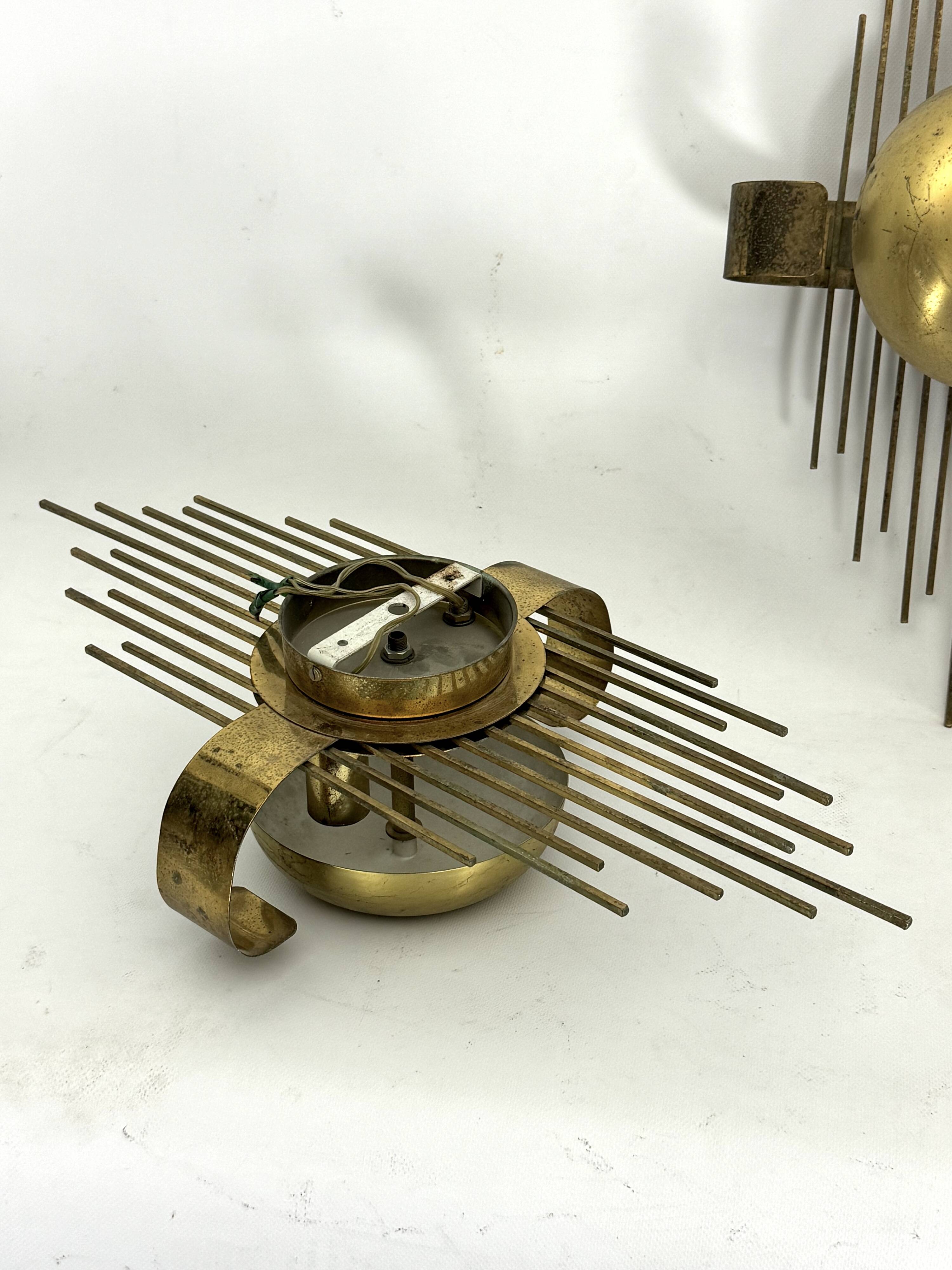 Mid-Century Set of three gilded metal sconces. Italy 1950s