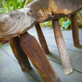 Pair of brutalist tripod stools in grayed pine. France, 1950s