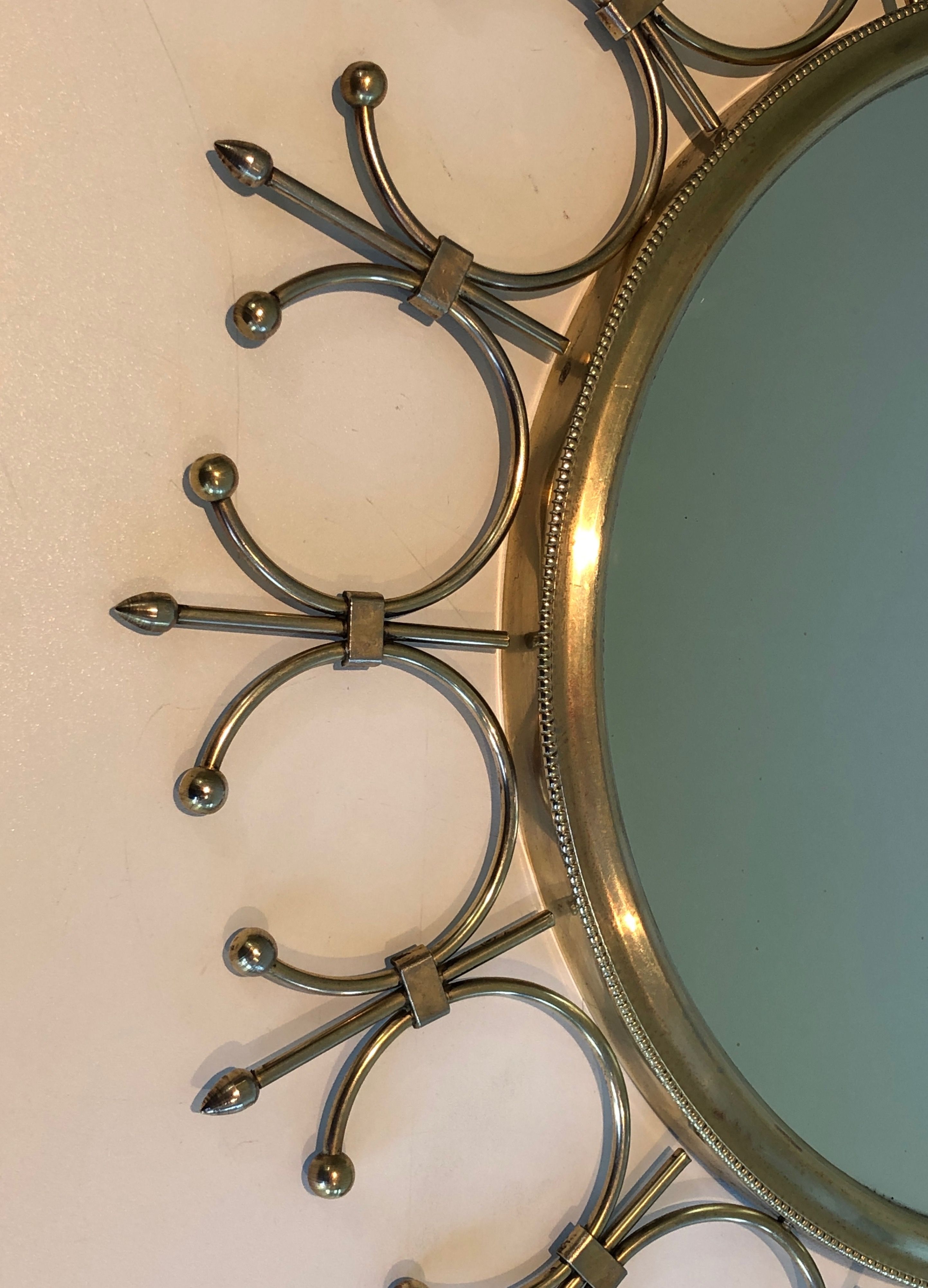 Sun mirror in brass and brushed steel