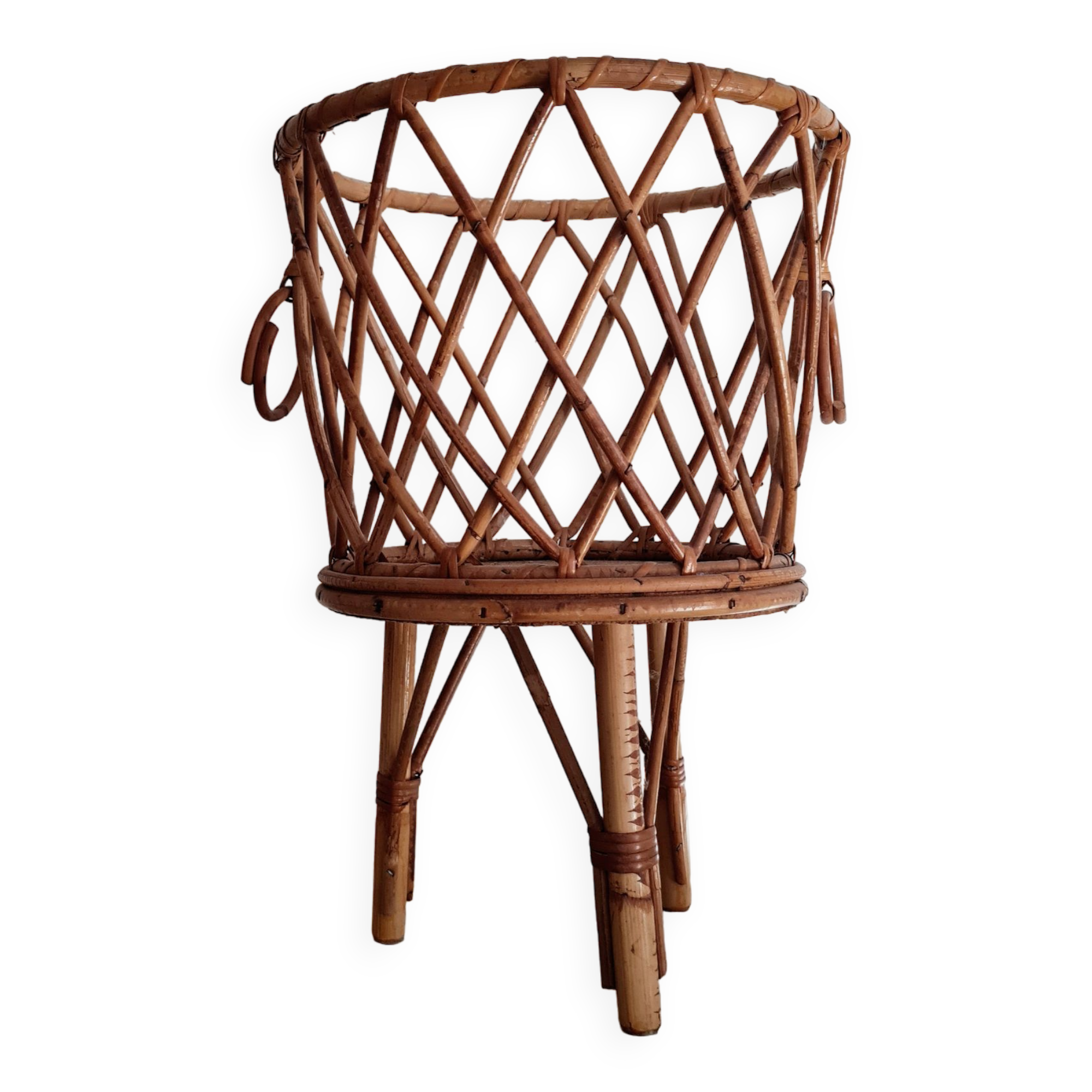 Old tripod rattan plant holder