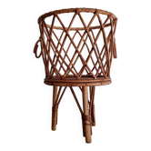 Old tripod rattan plant holder