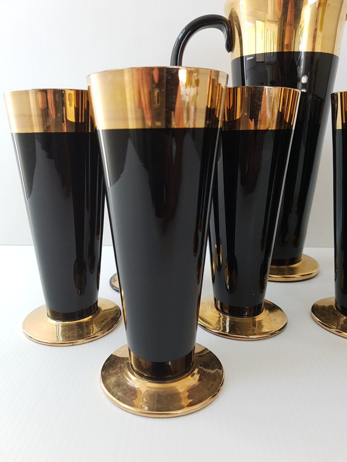 Vintage 1950s black and gold glass lemonade service.