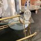 Porte revue en verre teinté et laiton