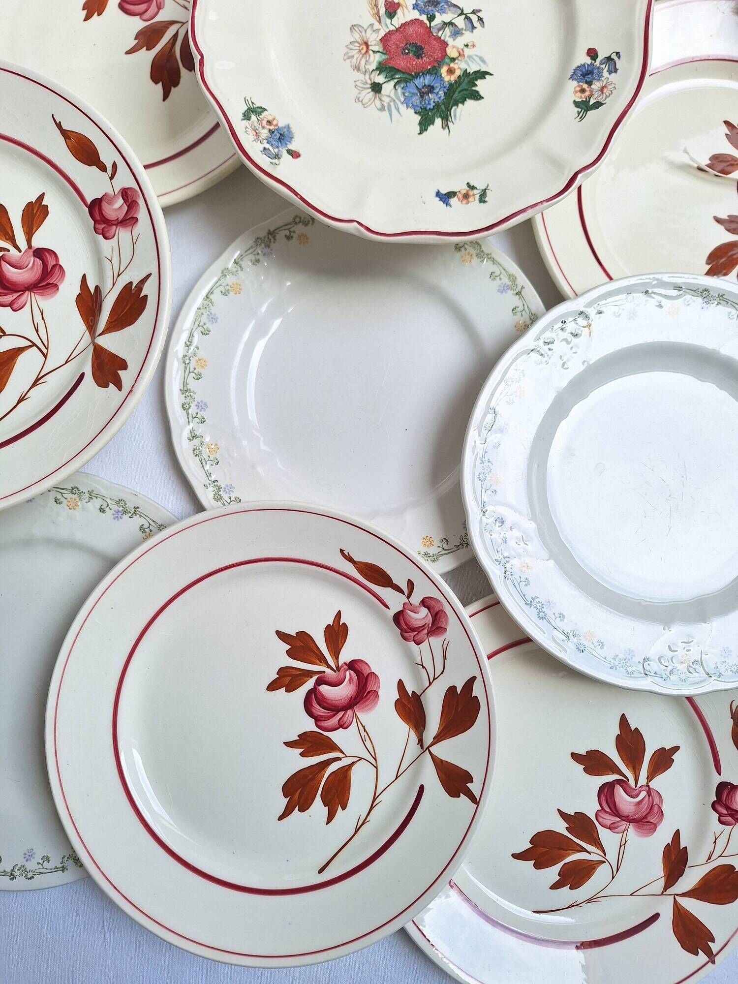 Vintage flower dessert plates from Sarreguemines, Longwy, and Lunéville.