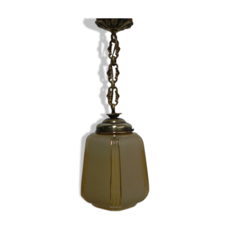 Art Deco lamp hanging on beige glass with ball chain