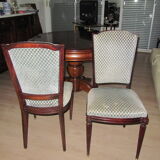 Table diameter 115 cm solid wood, excellent condition sold with 2 extensioncords of 40 cm each and 6 chairs style in excellent condition.