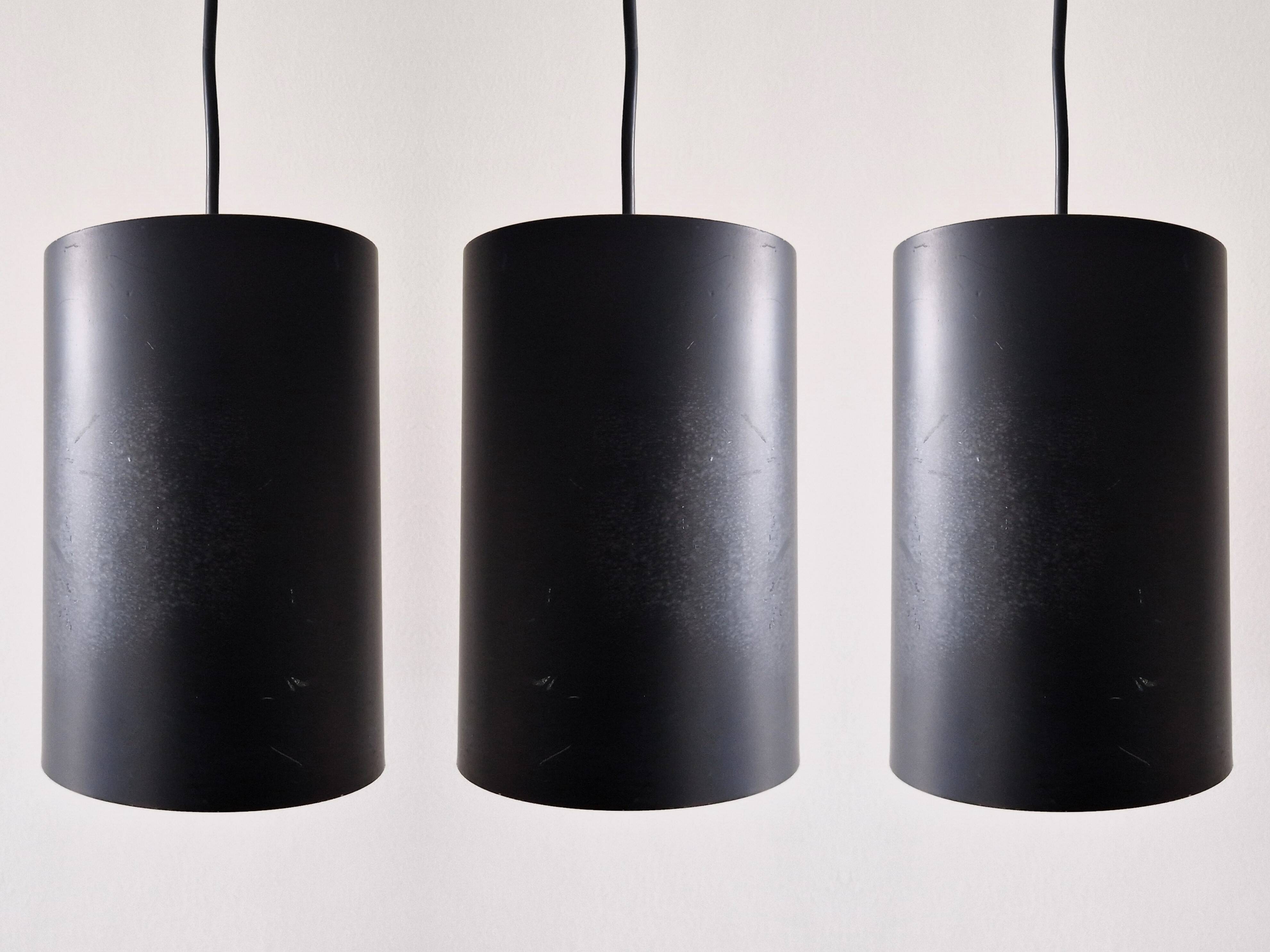 Set of 3 black cylinder pendant lamps, by Eila & John Meiling for Louis Poulsen, Denmark 1967