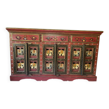 Indian furniture with three doors.