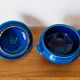 Blue ceramic soup tureen and crackled finish trivet.