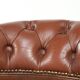 Swivel cowhide English style chesterfield office chair in a brown colour