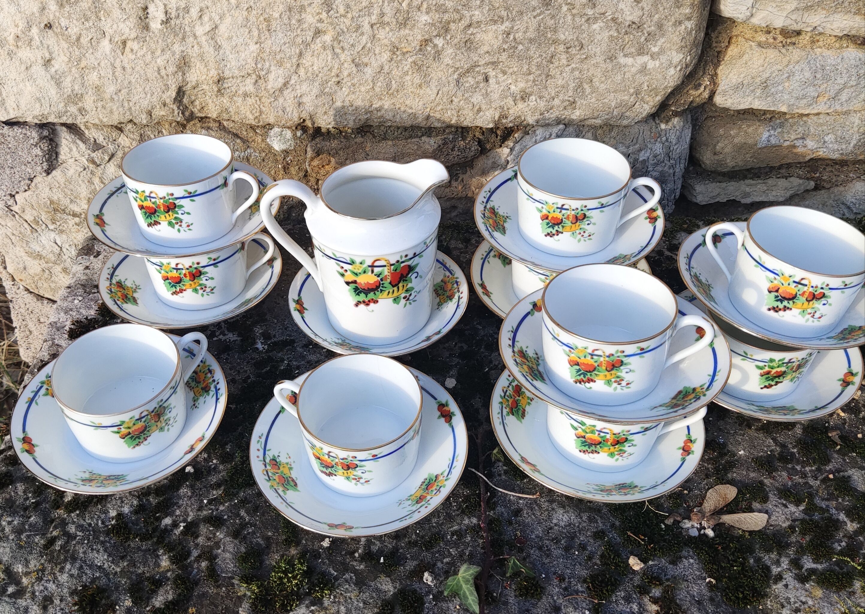 10 tea cups and creamer in Limoges porcelain