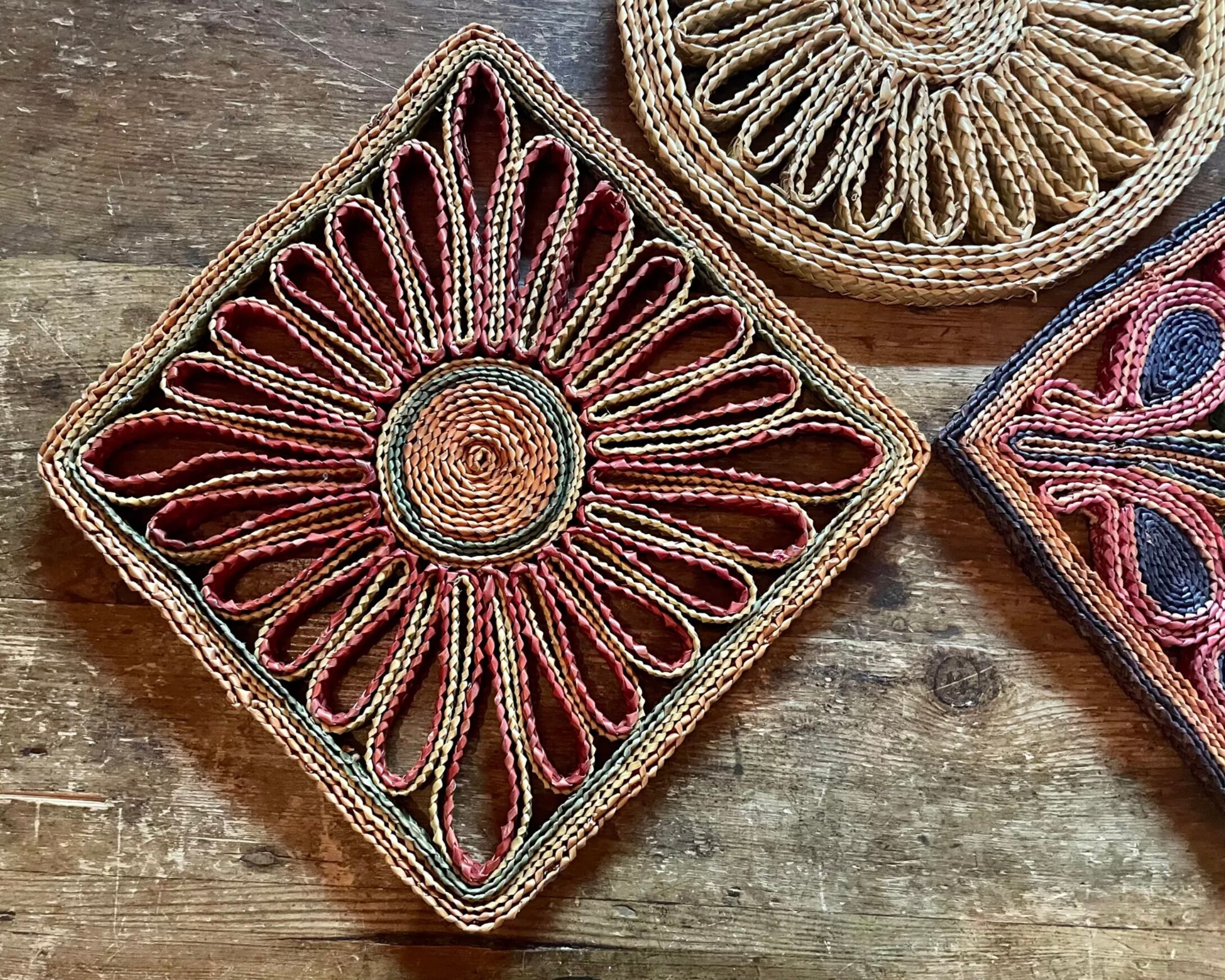 3 woven straw trivets
