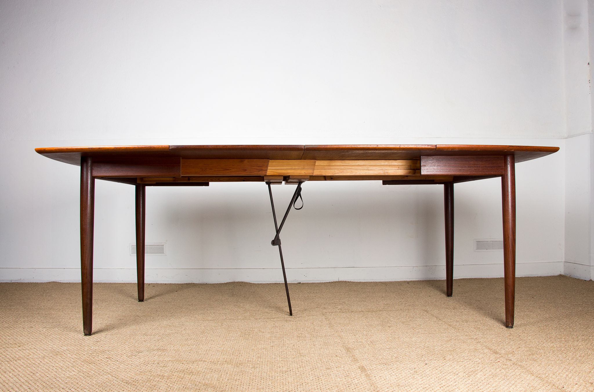 Expandable square teak dining table by Henry Walter Klein 1960