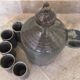 Old liquor service in sandstone, carafe and 5 glasses