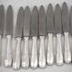 Boulenger Rambouillet 12 dessert, cheese, and fruit knives in silver-plated metal.