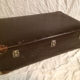 Suitcase vintage leather inside and brown carpeted home