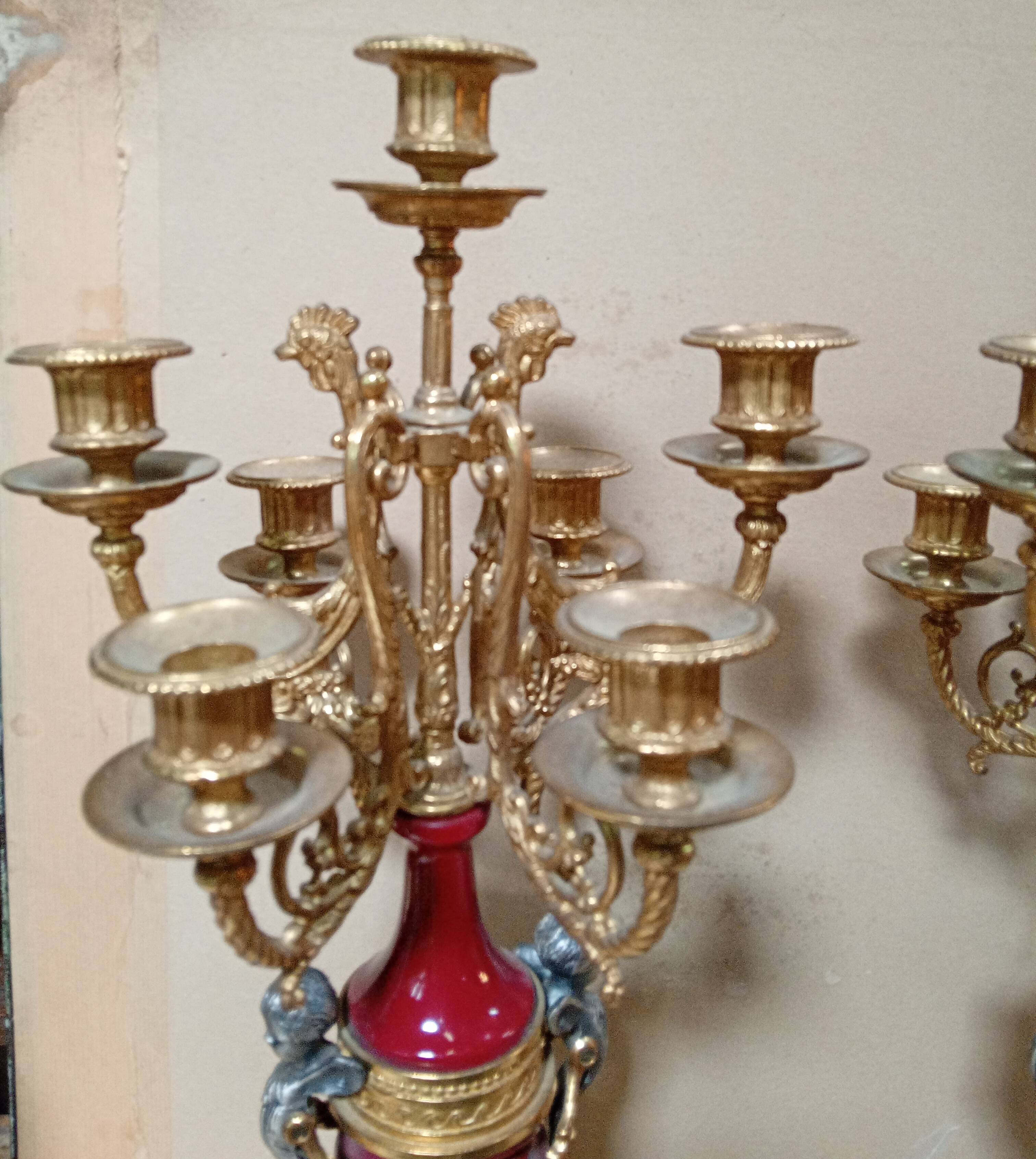 Pair of six-light candelabra in patinated and gilded bronze and spelter.