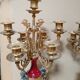 Pair of six-light candelabra in patinated and gilded bronze and spelter.