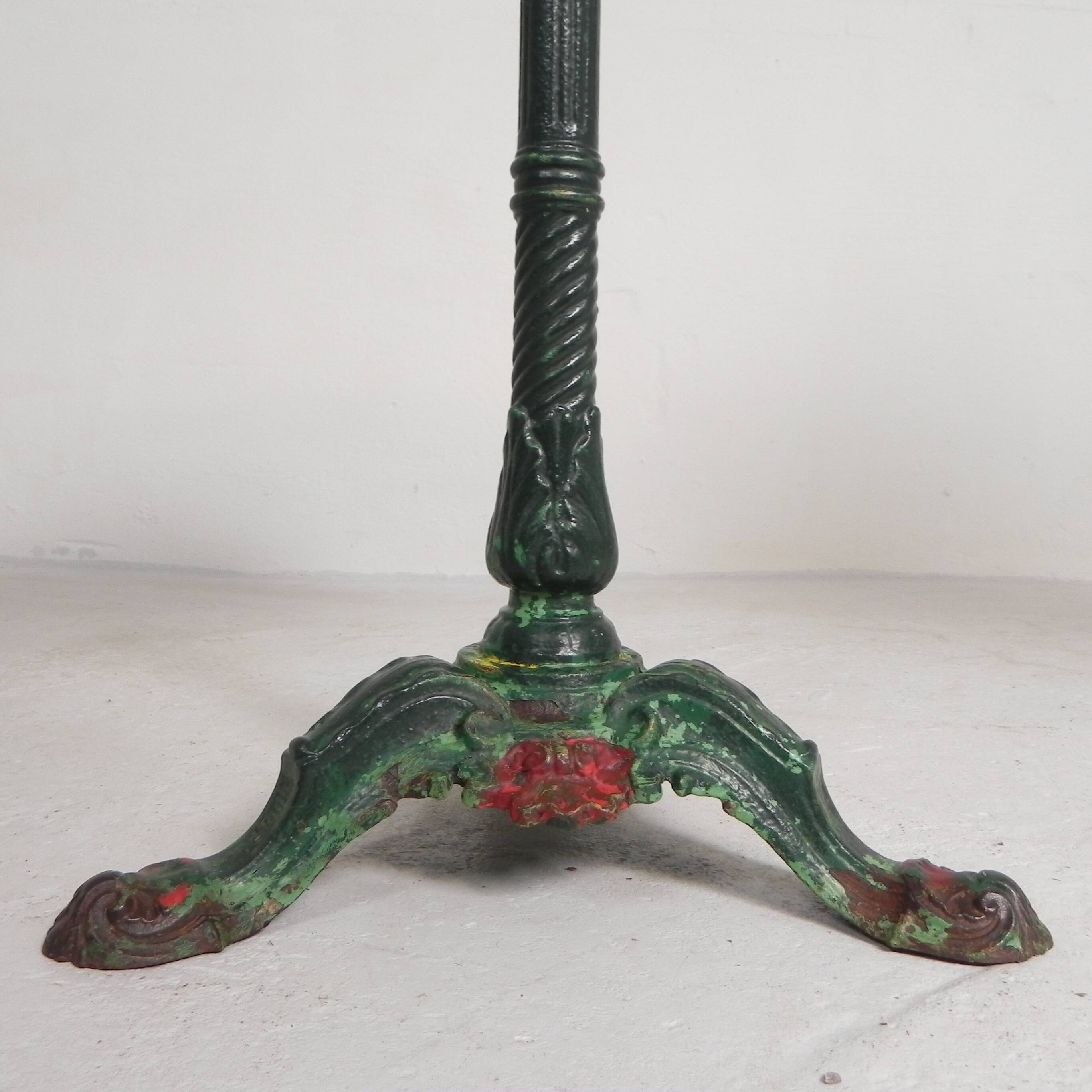 Bistro table with cast iron legs and marble top, 1920s.