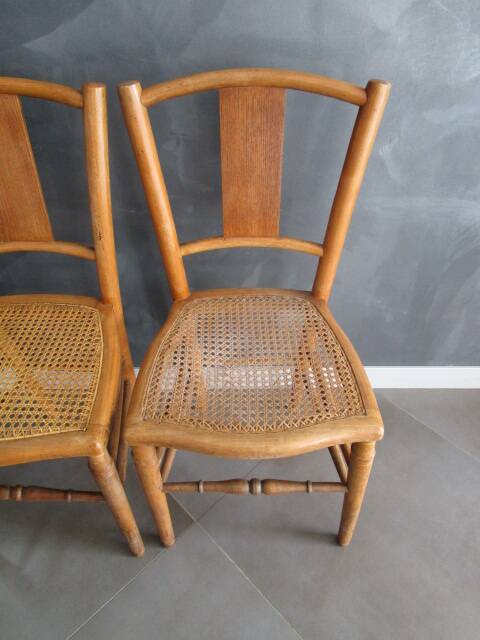 Pair of old caned chairs in blond wood