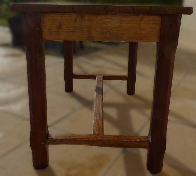 Oak farmhouse table with legs joined by a spacer