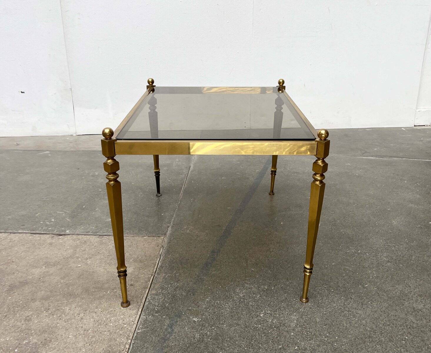 Mid-century German Hollywood neoclassical brass and glass side table from the 1950s.