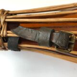 Amber and wicker glass bottle