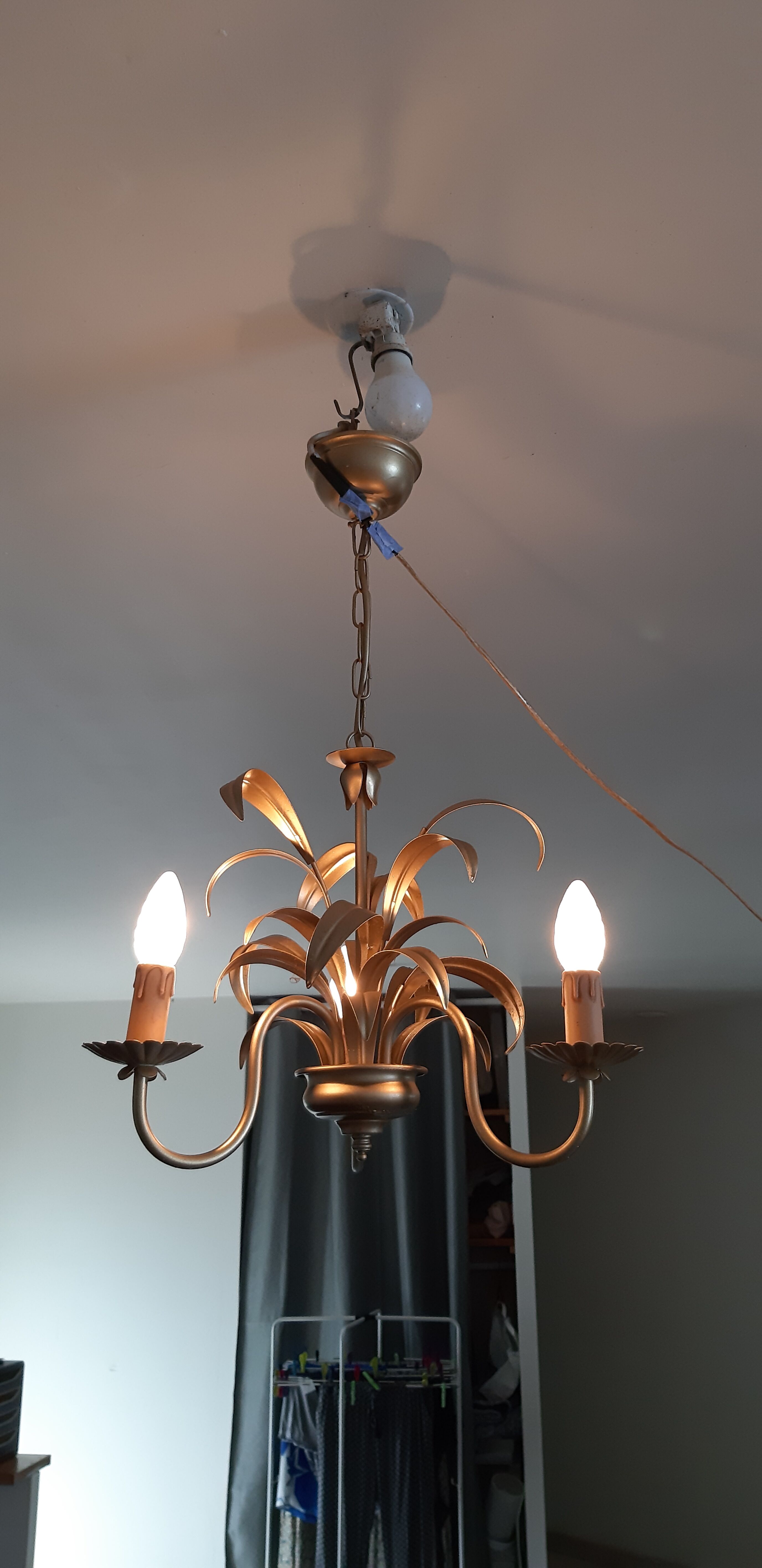 Vintage chandelier in golden metal