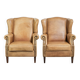 Set of two light cowhide wingback armchairs with a timeless English look