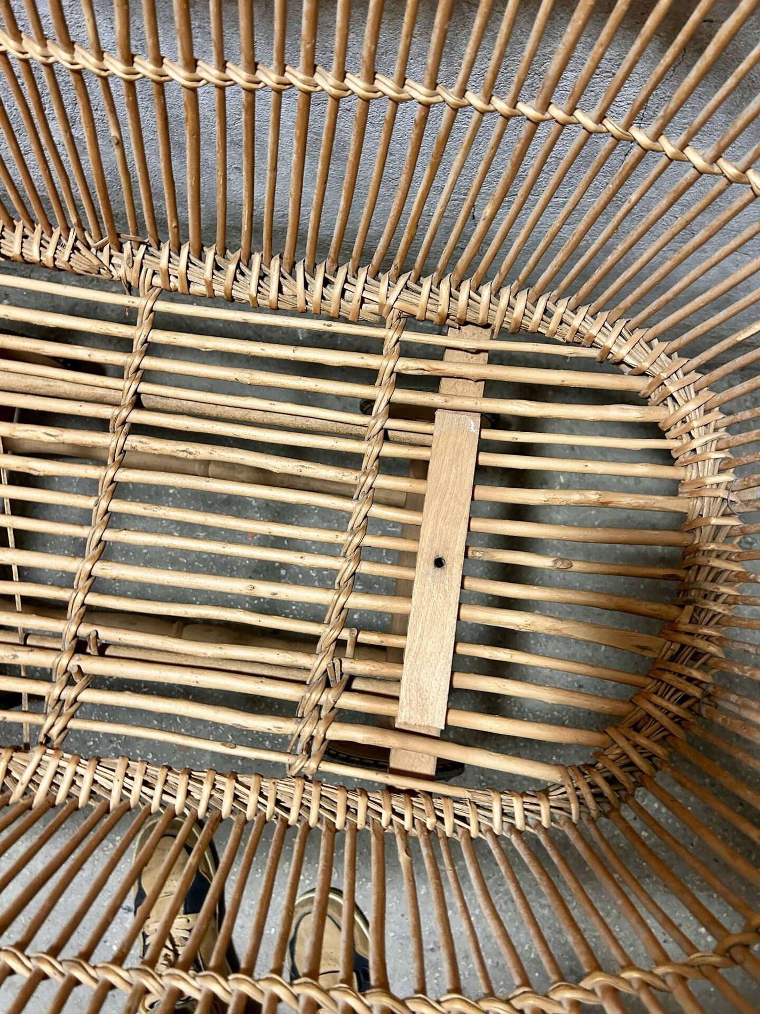 Vintage wicker cradle on wheels