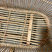 Vintage wicker cradle on wheels