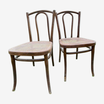 Pair of stamped Thonet bistro chairs, curved beech and cannage