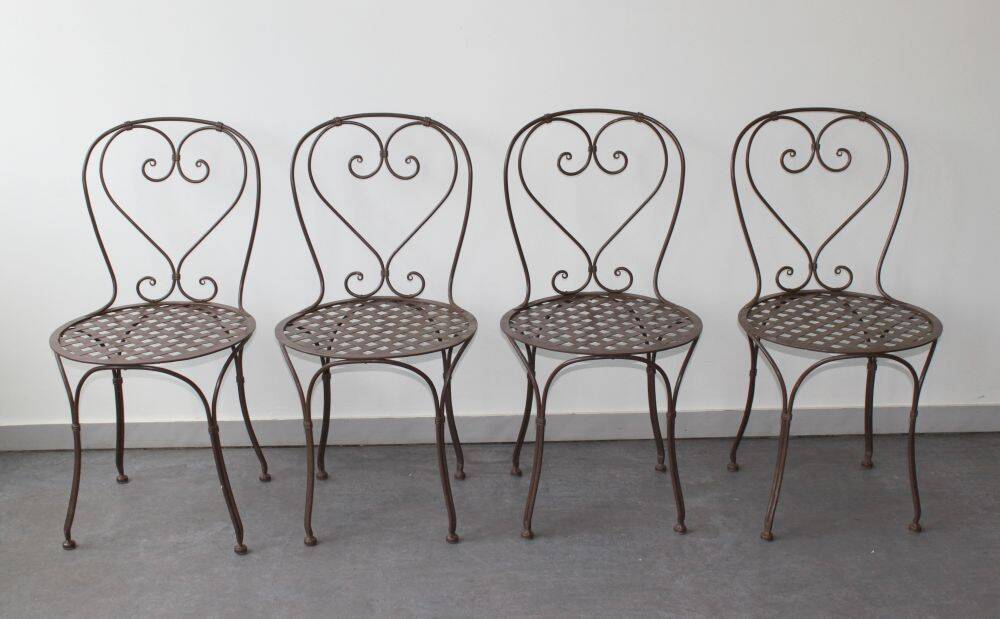 Set of 4 wrought iron chairs.