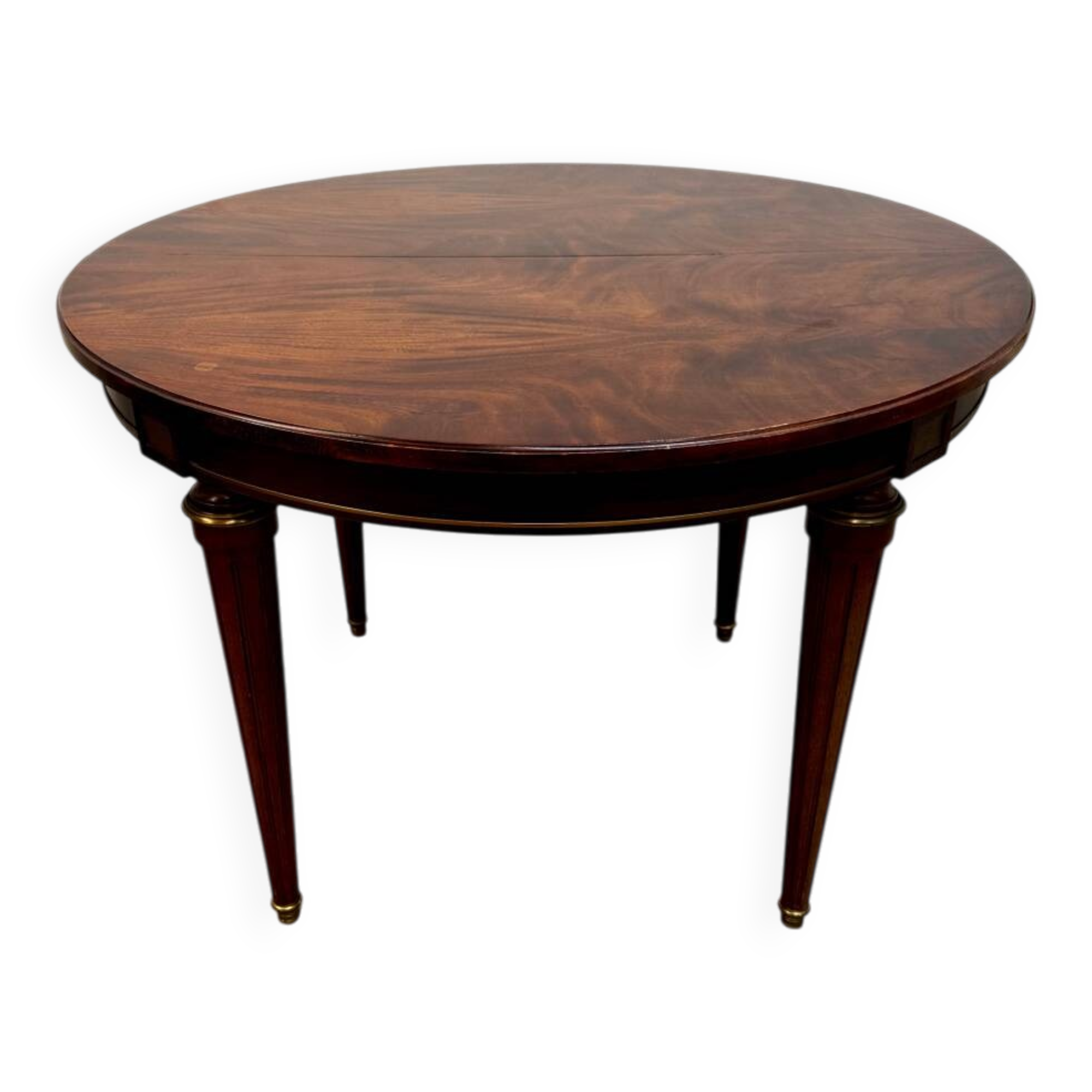 Extendable mahogany round table in Louis XVI style