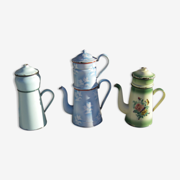 Set of three enamelled coffee makers.