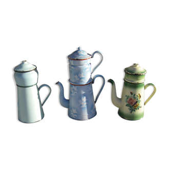 Set of three enamelled coffee makers.