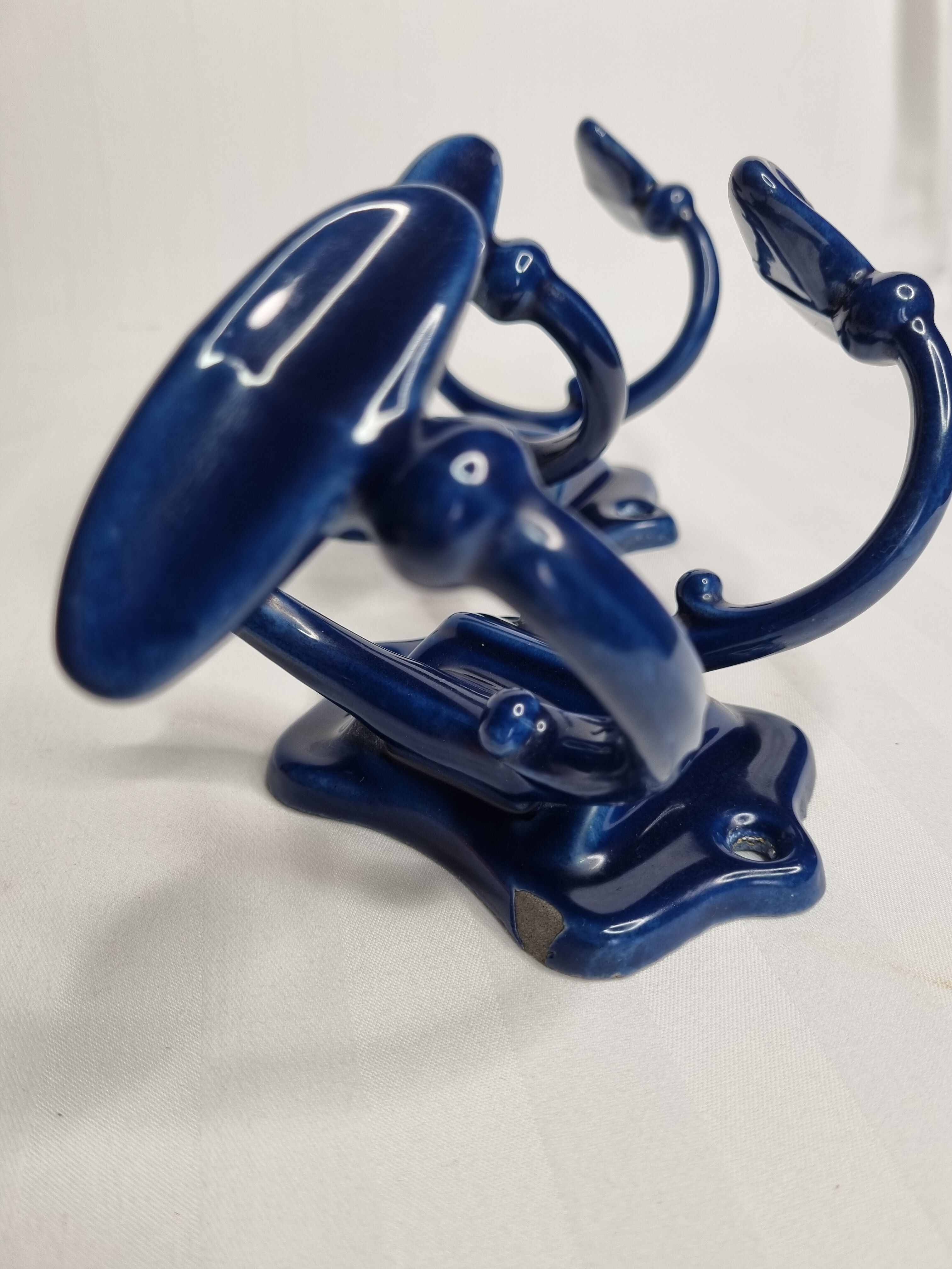 Pair of 1910 art nouveau period coat hooks in blue enameled cast iron