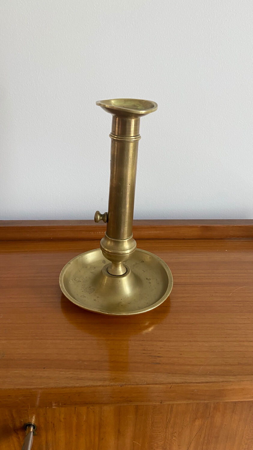 Antique brass push candle holder