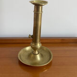 Antique brass push candle holder