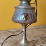 Repoussé brass lamp with floral motifs, decorated with 3 miniature medallions