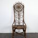 Set of 4 bamboo and rattan chairs with sunflower decoration.