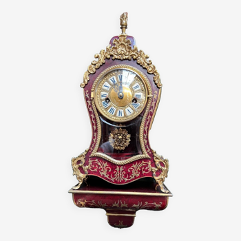 Boudoir clock on Louis XIV style console.