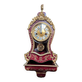 Pendule boudoir sur console de style Louis XIV.
