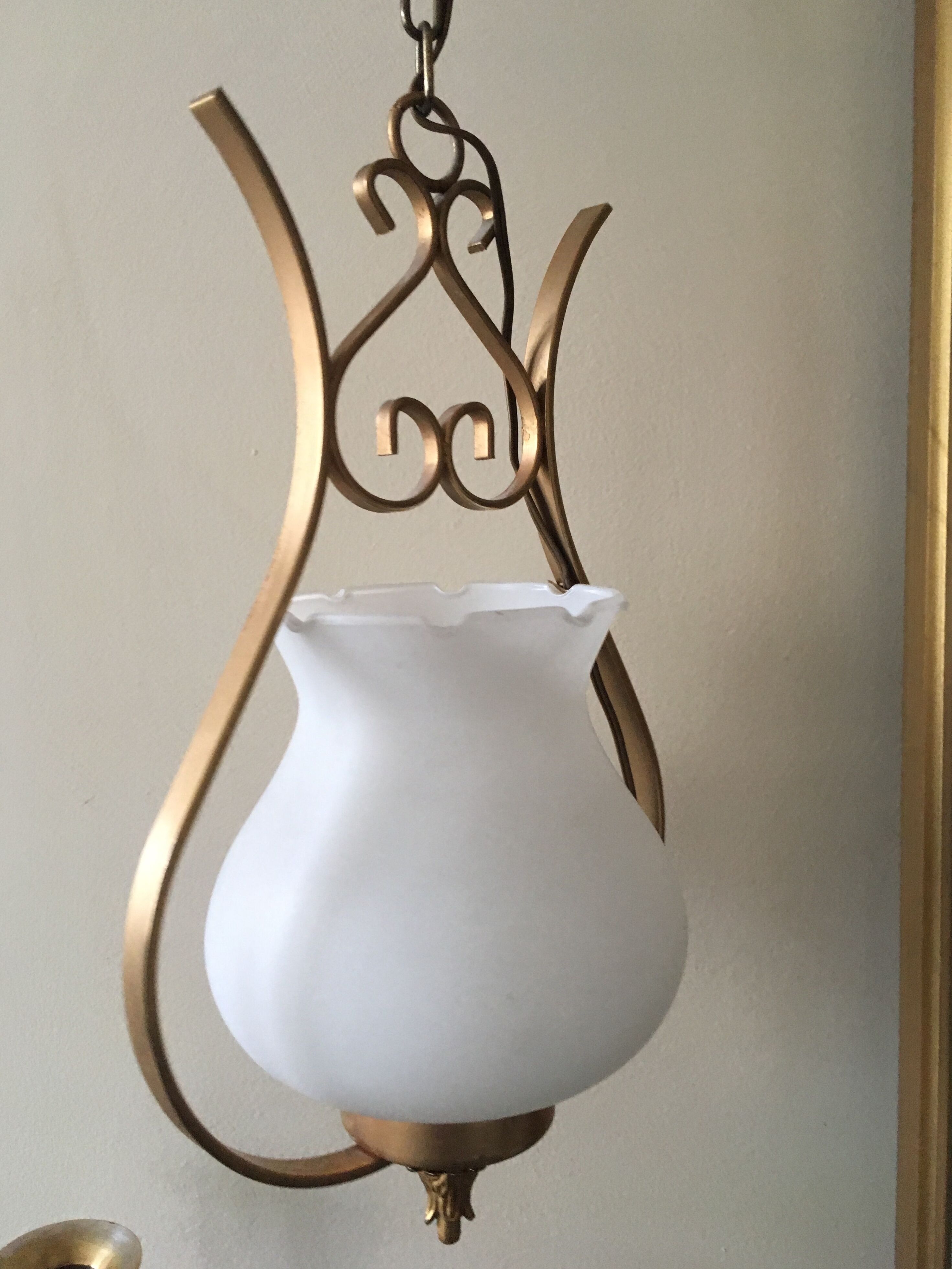 Pair of white tulip and brass pendant lamps