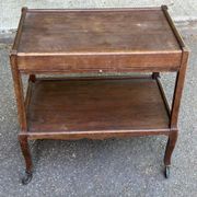 Extendable wooden bar trolley with a glass top from the 1930s.
