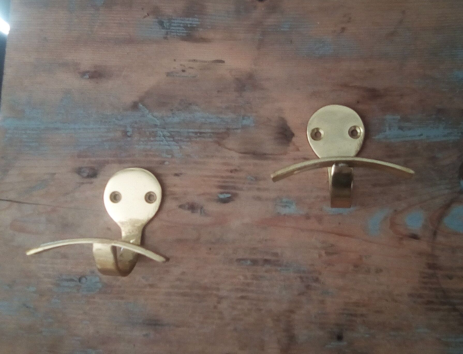 Pair of coat racks in gilded steel 70s/80s