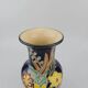 Large multicoloured ceramic vase with floral decoration signed NT.